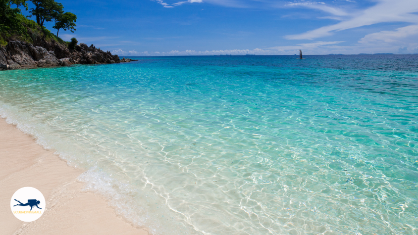 Clear emerald green waters of Dimakya Island Philippines